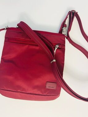 Pacsafe Burgundy Red Crossbody Bag with Adjustable Strap